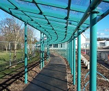 Heavy Duty system with Mono Pitch roof, Clear Pet-g sheeting, with additional feature of design to match curved pathway  