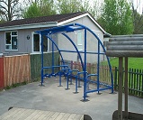 FS23 - Harlan style 12 cycle shelter, with solar lighting and integrated scooter rack