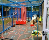 FS58 - Monopitch canopy with sidewalls, used as an external classroom/play area
